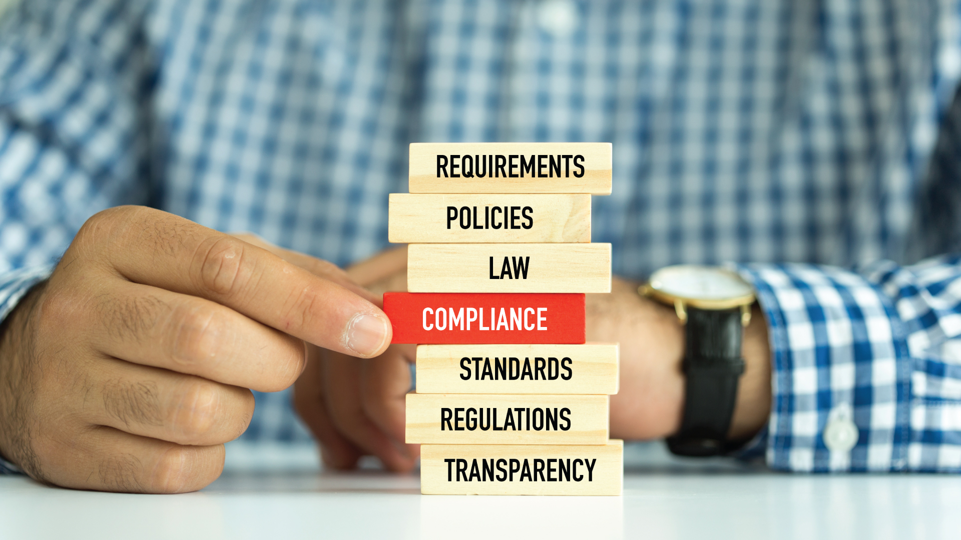 Offshoring - A businessman on top of the word stacks - iSupport Worldwide